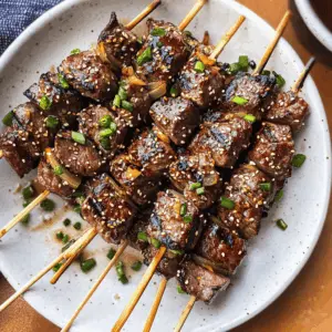 Unlock the mouthwatering flavors of Asian Garlic Steak Skewers, marinated to perfection! This recipe features tender beef infused with aromatic garlic and a hint of soy sauce, creating a deliciously savory experience. Perfect for grilling season or a weeknight dinner, save this pin to impress your family or friends with an easy and flavorful meal!