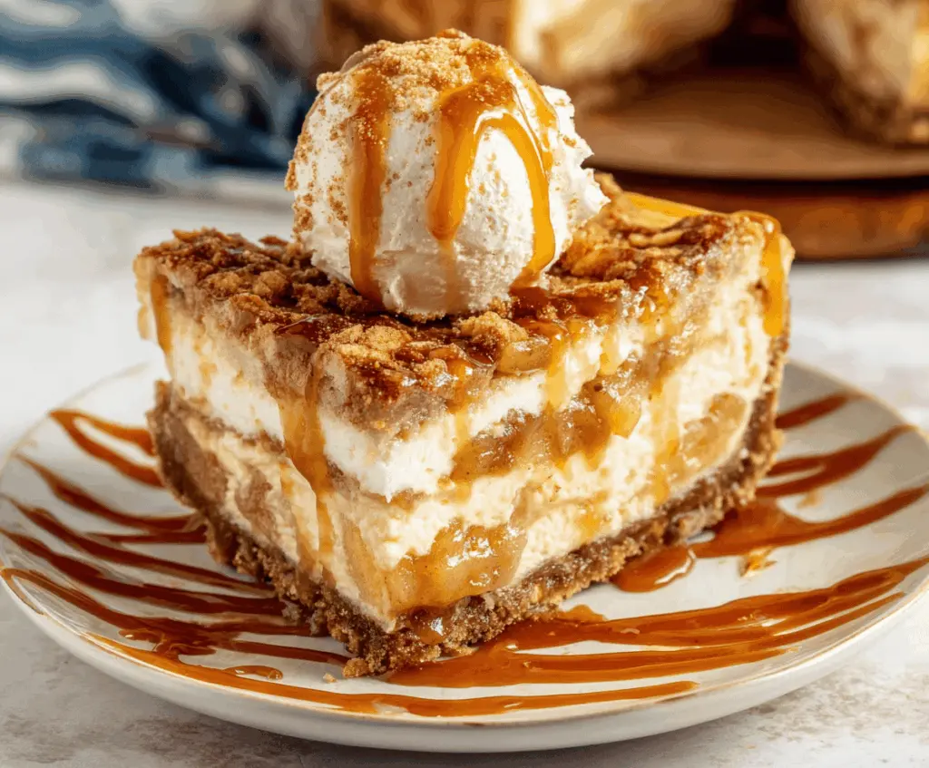 Delicious Salted Caramel Apple Pie Cheesecake with a golden crust and caramel drizzle