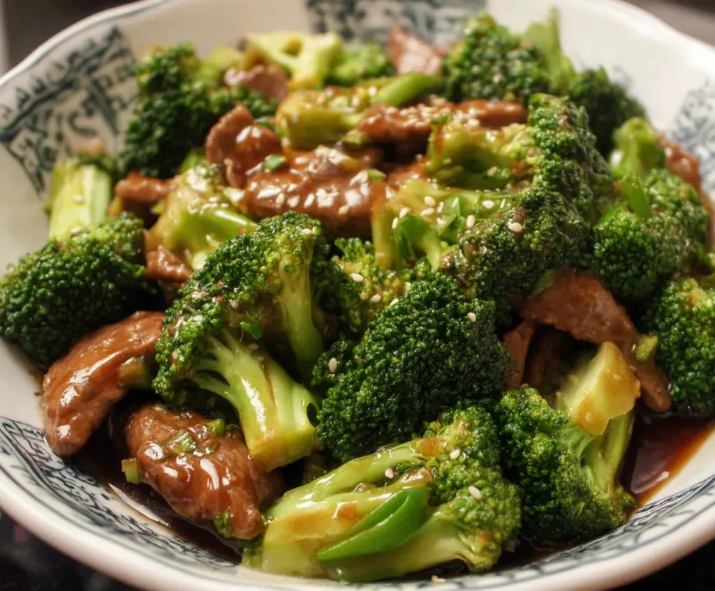 Delicious Chinese beef and broccoli stir-fry served on a white plate with vibrant vegetables.